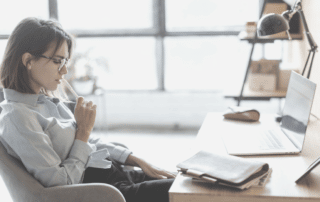 Using critical observation as an Assistant. Woman in office looking at computer